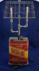Gasoline can lamp with two bulbs and wire basket shade.